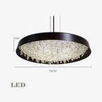 Black-framed chandelier with crystal accents, 54 cm wide, 7 cm high, hung by slim cables.