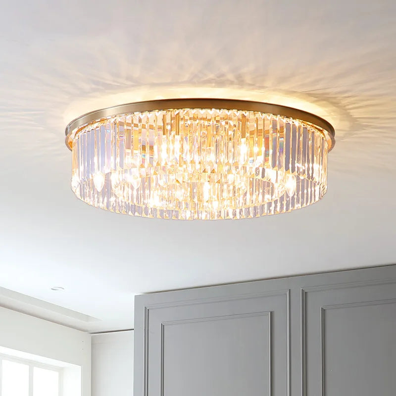 Maison Ornate Luxury Nordic Crystal Chandelier with gold circular base and vertical glass prisms.