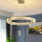 The Maison Ornate Nordic Design Crystal LED Chandelier features multiple lighted rings suspended by wires.