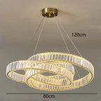 Intertwined gold rings with crystals form a suspended, modern chandelier; size: 120x80 cm.