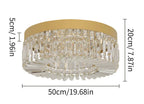 Modern gold chandelier with vertical crystal rods, integrated LED lights, and a sleek round design.