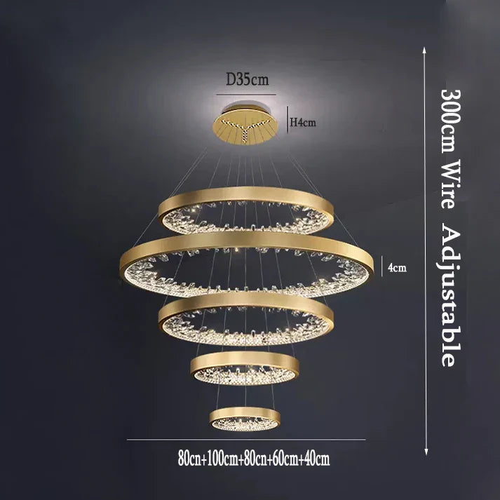 Crystal-adorned gold chandelier with five adjustable LED rings, dimmable lighting, max 300cm height.