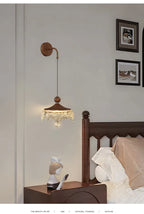 A Maison Ornate French Medieval Style Crystal Teardrop Chandelier with intricate detailing and sparkling crystals.