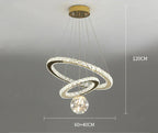 Modern gold chandelier with two LED rings, crystal glass ball, and round ceiling mount. 120 cm height.