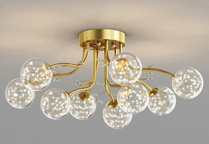 Gold chandelier with curved arms, each holding a glass globe filled with LED star lights.