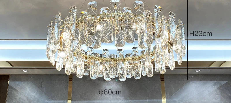 Gold-accented modern crystal LED chandelier, 80 cm wide, 23 cm high, with elongated reflective crystals.