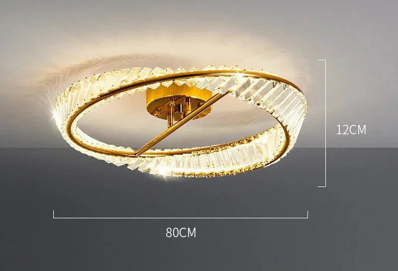 Gold-framed modern LED chandelier with crystal glass rings, dimmable, 80 cm wide, ceiling-mounted.