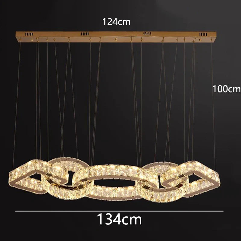 Gold crystal chandelier with interlocking rings, dimmable, 124x134cm, hangs 100cm on multiple wires.