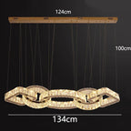 Gold crystal chandelier with interlocking rings, dimmable, 124x134cm, hangs 100cm on multiple wires.
