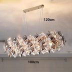 Elegant modern stainless steel crystal LED chandelier with faceted glass, gold mount, 120x100 cm.