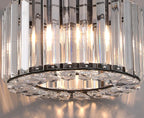 Close-up of Maison Ornate Art Deco crystal chandelier with clear prisms, metal frame, adjustable rope.