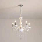 Baroque crystal chandelier with five candle bulbs, curved arms, and hanging crystals for elegant shine.