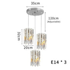 Round gold crystal chandelier with three LED lampshades, adjustable cords, and E14 bulb fittings.