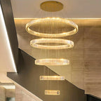Modern Crystal Chandelier by Maison Ornate with six dimmable glowing rings of varying sizes.
