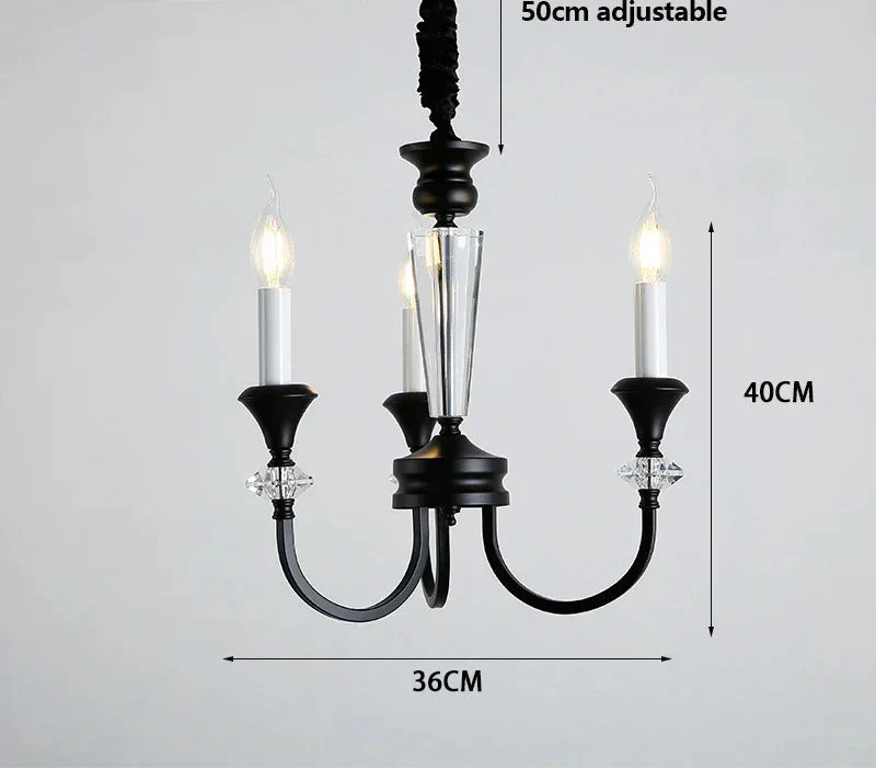 Three-arm vintage crystal chandelier in black and clear glass with candle-style LEDs, luxury finish.