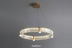 Crystal chandelier with gold LED rings, glass panels, and four bulbs suspended by thin cables.