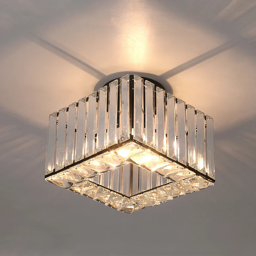 Maison Ornate Art Deco chandelier with adjustable lights, vertical crystal bars, and warm decorative glow.