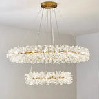 Maison Ornate's chandelier with two crystal-adorned circular tiers, suspended by sleek metal wires.