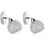 Modern chandelier-style lights with chrome bases and crystal-accented spherical shades, elegant and reflective.