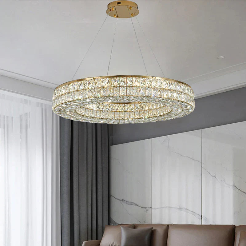 The Maison Ornate Art Deco circular crystal chandelier with LED lights, elegant and luxurious.