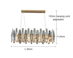 Gold ceiling mount K9 crystal chandelier with adjustable cords, vertical glass, and integrated LED lights.