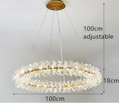 Gold-framed chandelier with crystal accents, floral motifs, and adjustable height, 100 cm diameter.
