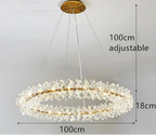 Gold-framed chandelier with crystal accents, floral motifs, and adjustable height, 100 cm diameter.