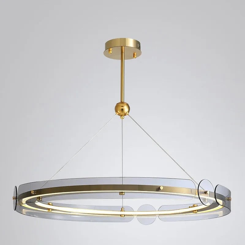 Nordic Art Deco chandelier with gold finish, circular glass, LED ring, and thin suspension wires.