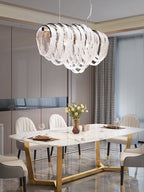 Maison Ornate’s Modern Nordic Crystal Chandelier with LED Tassels and curved crystal-like elements.