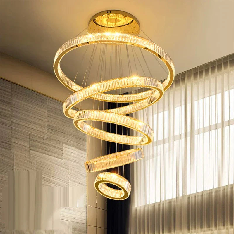 Maison Ornate Modern Crystal Chandelier with glowing rings and dimmable, warm golden light.