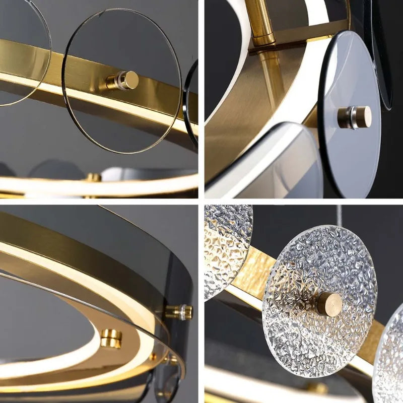Close-up of Maison Ornate Art Deco Crystal Chandelier with gold rings, rods, and textured glass circles.
