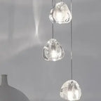 Set of three Maison Ornate modern crystal LED chandeliers with clear shades, long vertical design.