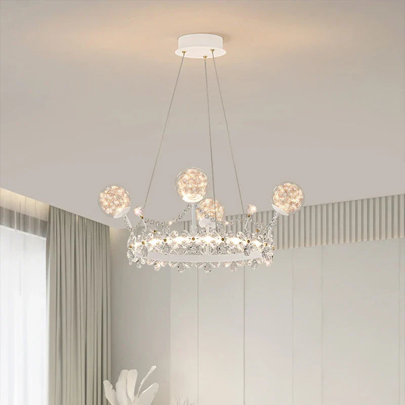 Modern crown-shaped crystal ball chandelier with six globe bulbs in a circular design.
