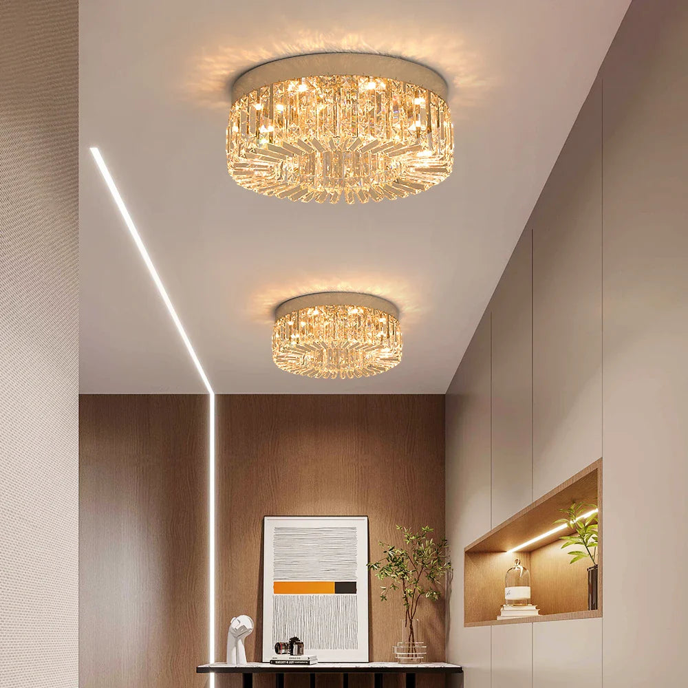 Pair of Maison Ornate modern gold crystal LED chandeliers, elegant and bright, ceiling mounted.