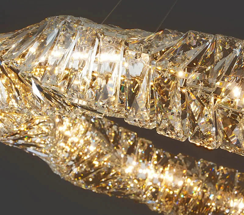 Intertwined faceted crystal chandelier rings with dimmable LEDs for sparkling, customizable luxury illumination.