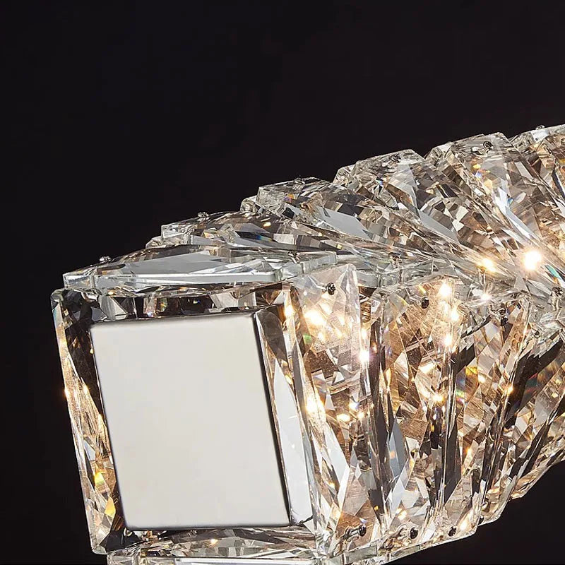 Close-up of Maison Ornate's LED crystal chandelier rings with faceted crystals and bright, dimmable LEDs.