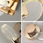 Collage of four close-ups features modern gold LED crystal chandeliers with circular bubble-glass accents.