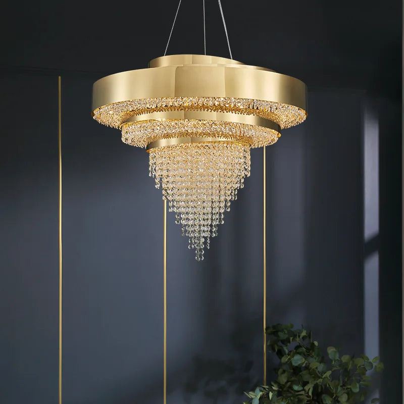 Modern gold crystal chandelier with three circular crystal tiers and integrated LED lighting.