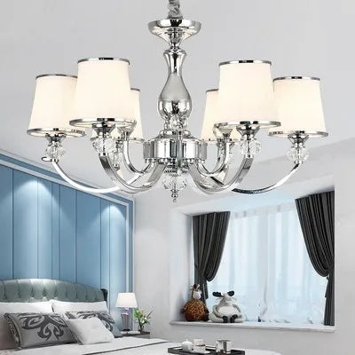 The Maison Ornate Baroque Crystal Chandelier features six white shades and luxurious crystal detailing.