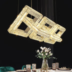 Maison Ornate Gold Crystal Pendant Light features square intersecting crystal frames and integrated LED lighting.