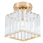 Modern crystal chandelier with gold base, square frame, and vertical clear glass panels.