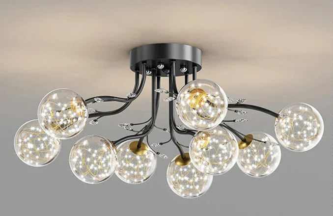 Maison Ornate Crystal Ball Chandelier with LED stars, black arms, clear glass globes.