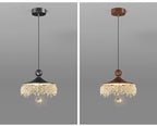 Two Maison Ornate French Medieval style crystal teardrop chandeliers with black and brown tops, elegant crystal fringe.
