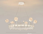 Crown-shaped crystal ball chandelier with sparkling accents and round lights on slim wires.