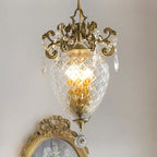 Medieval-style gold pineapple crystal chandelier with faceted glass and ornate gold detailing.