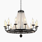 Iron and acrylic chandelier with twelve candle-style bulbs, circular frame, and hanging crystal strands.