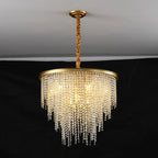 Maison Ornate Modern Crystal Chandelier with gold chain and cascading crystal prisms sparkling brightly.