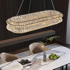 Maison Ornate Crystal Ball Pendant with stainless steel adjustable cord, modern spherical chandelier lighting.