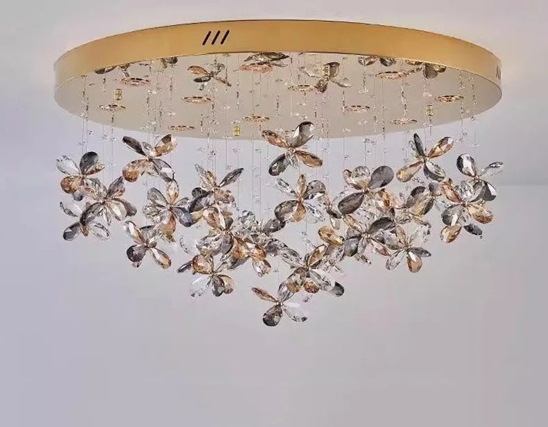 Gold-base modern LED chandelier with cascading crystal floral pendants for elegant, sparkling illumination.