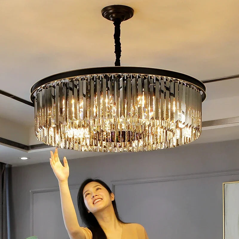 Maison Ornate Modern Crystal Chandelier with geometric framework, glowing lights, and cascading hanging crystals.